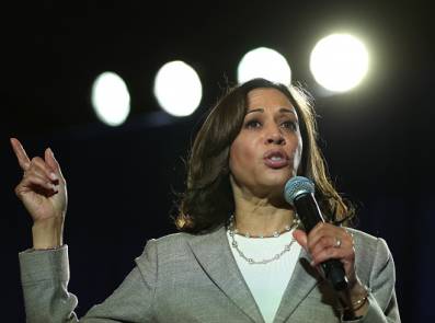 congresswoman speaking on a microphone
