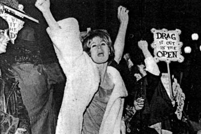 woman in a dress walking in a show