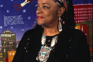 woman in a dress walking in a show